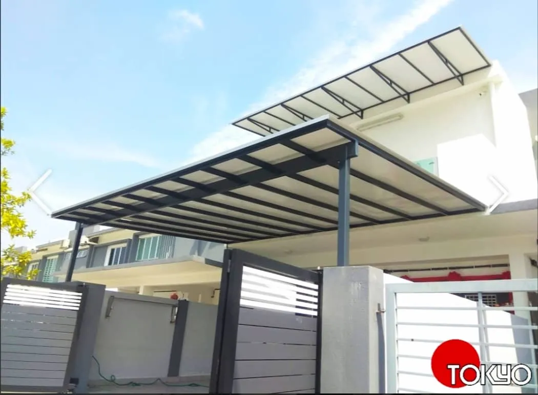 Slanted ACP roof awning installed over a car porch driveway