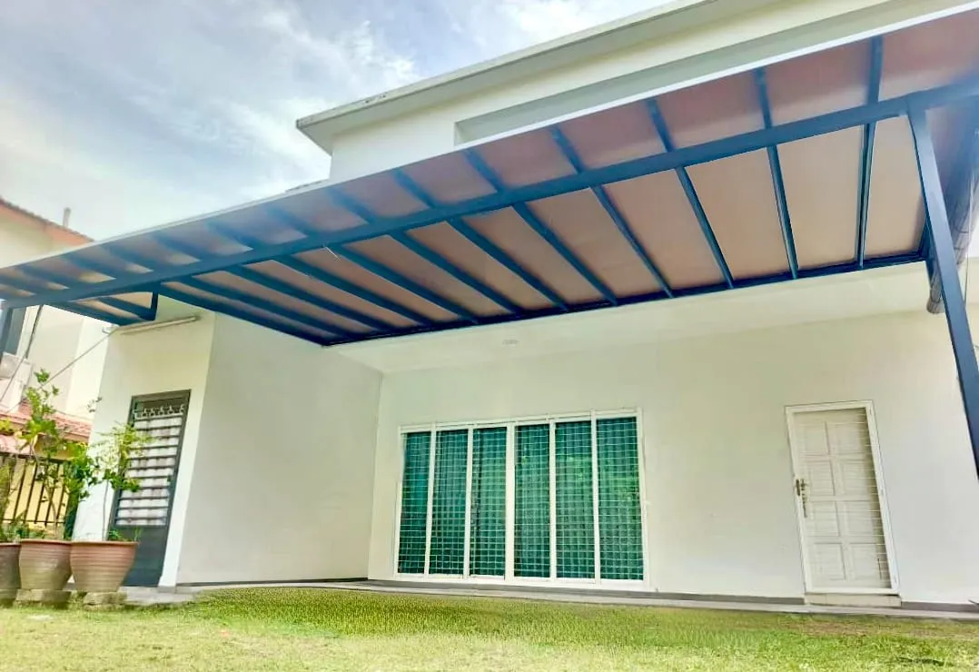 ACP roof awning over a backyard patio with garden view