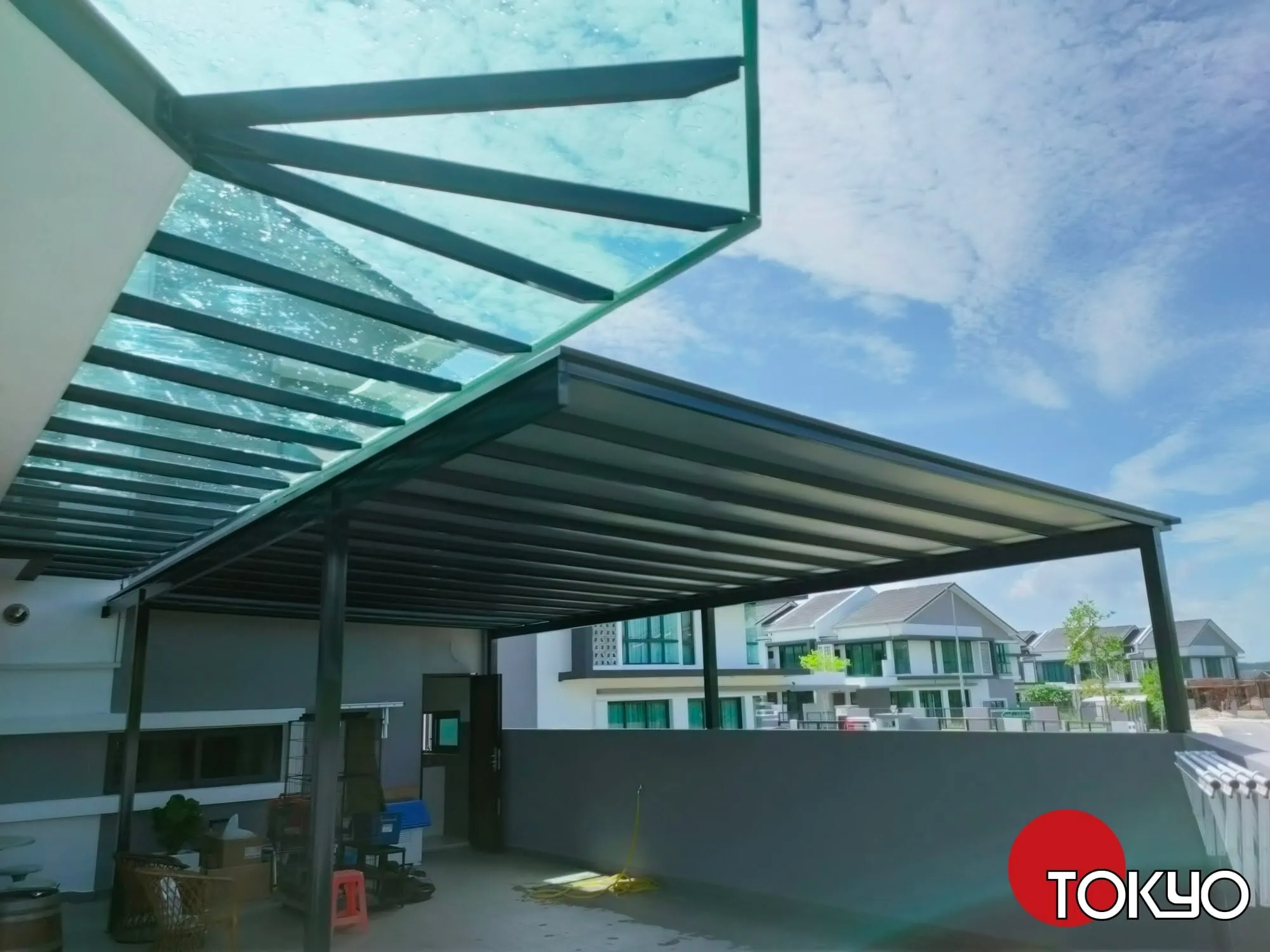 Glass roof pergola over a rooftop pool deck — real New Tokyo Awning project serving the Bangi area