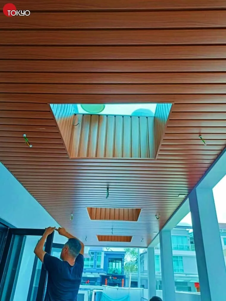 Installation in progress on a C-roof awning with a glass skylight panel — real completed project serving the Petaling Jaya area