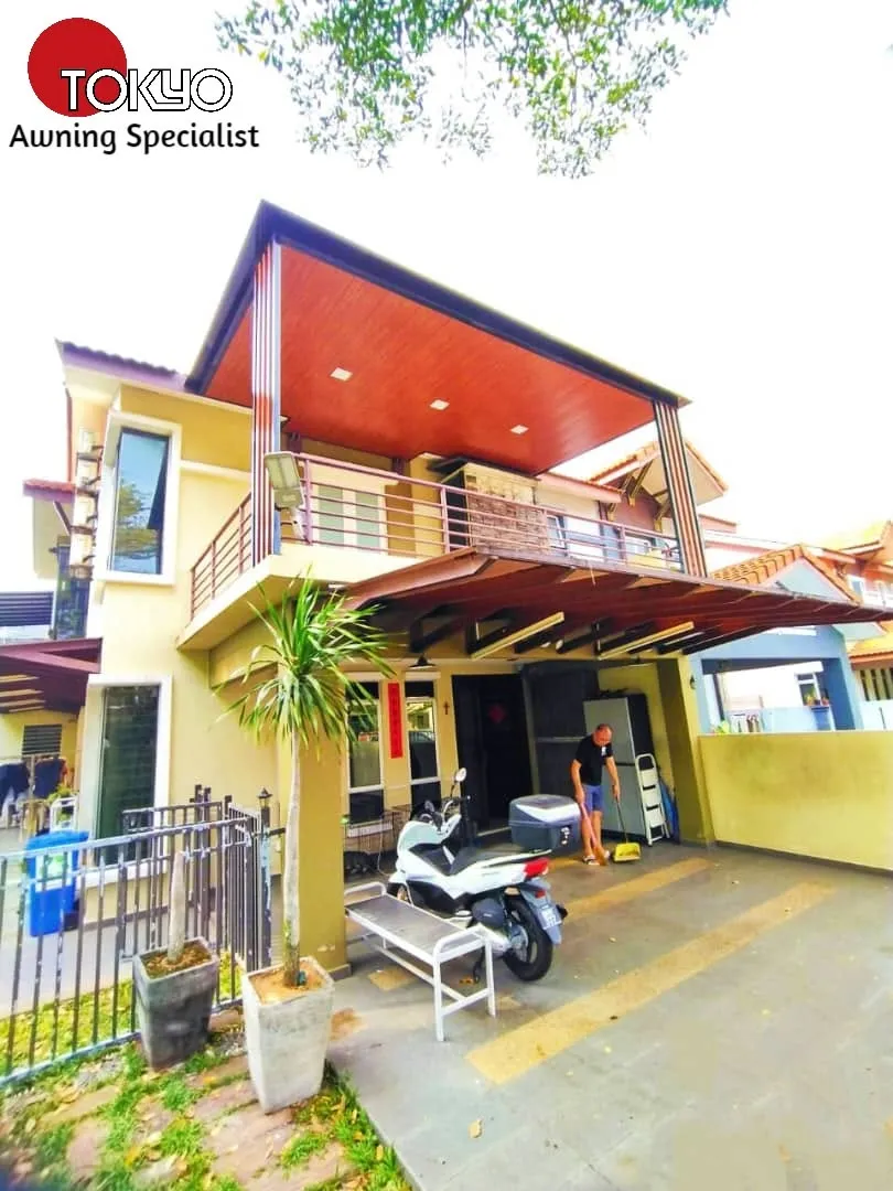 C-roof awning over an upper-floor balcony above a car porch — real completed project serving the Puchong area