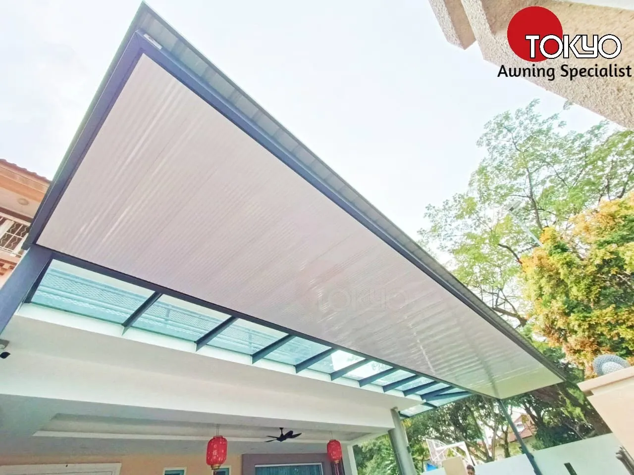 C-roof awning over a tiled patio, decorated for Chinese New Year — real completed project serving the Putrajaya area